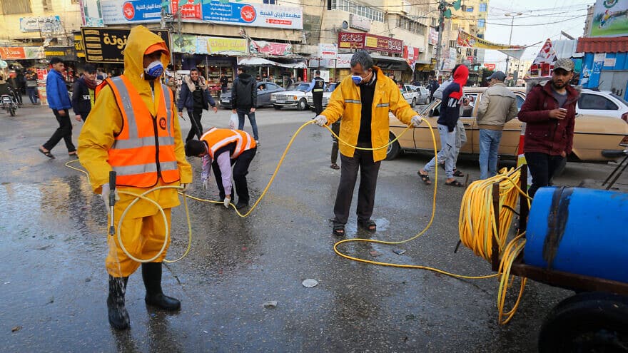 Hamas seeks to prevent spread of virus in Gaza, while threatening to hold Israel responsible if it fails